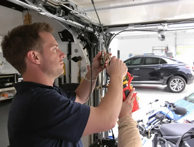 Beachwood Garage Door Repair safety certified technician performing cable replacement in Beachwood