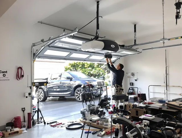Beachwood Garage Door Repair specialist installing smart garage door opener system in Beachwood home